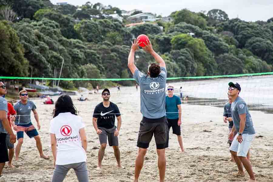 Team taking part in beach activities