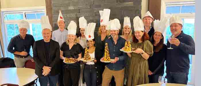 Team building a croquembouche dessert