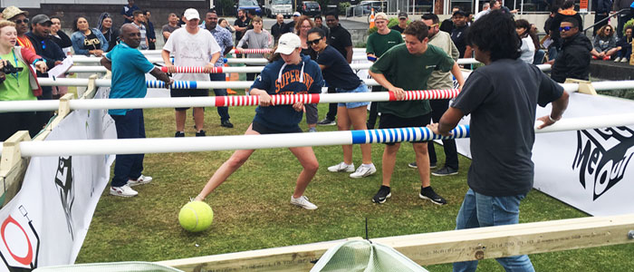 Team playing Human Foosball